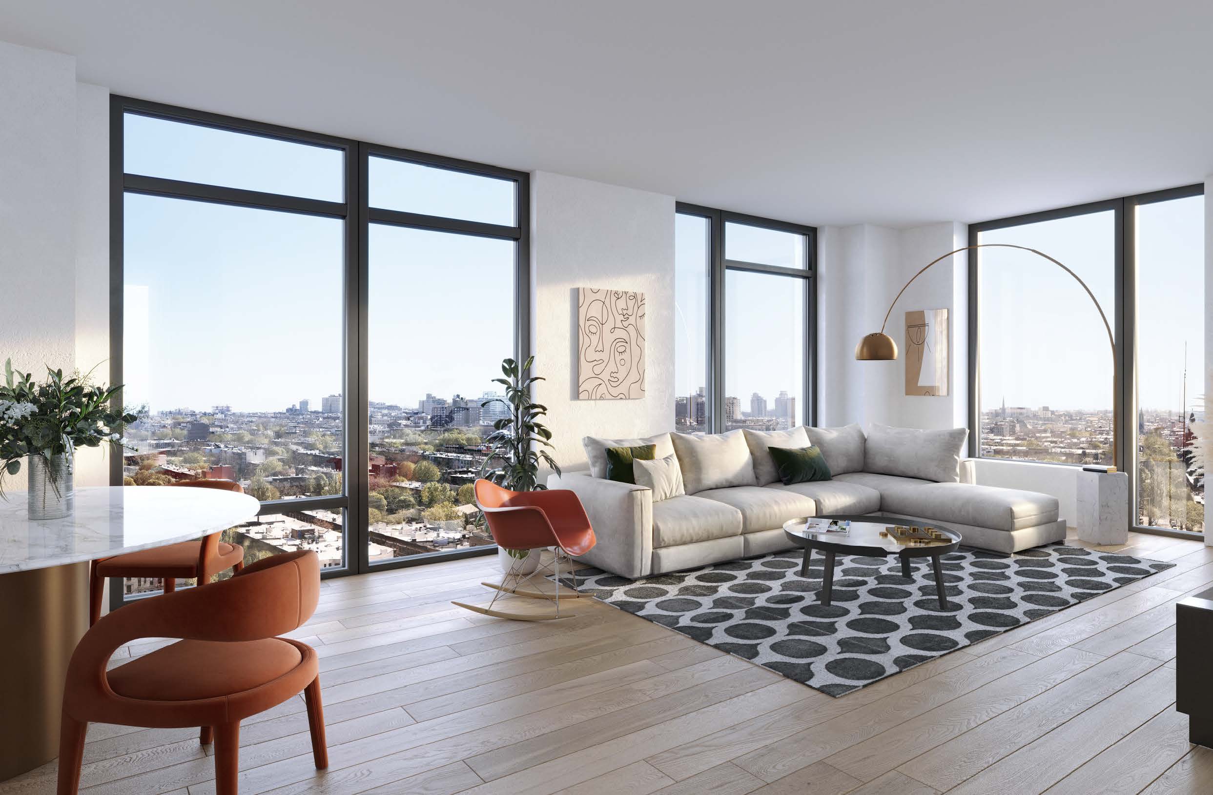 Large living room with floor to ceiling windows and luxury furnishings at Plank Road. Rental apartments in Prospect Heights.